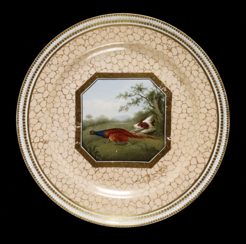 Pheasant Plate Of porcelain, painted with enamels and gilded.